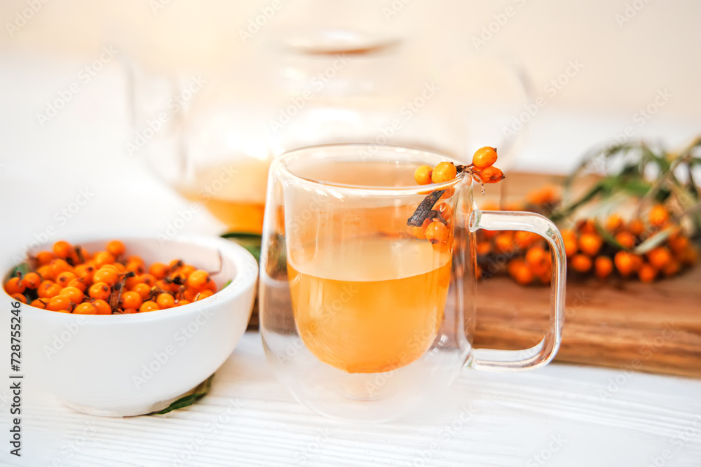 glass teapot filled with refreshing sea buckthorn tea glass teapot filled with refreshing sea buckthorn tea