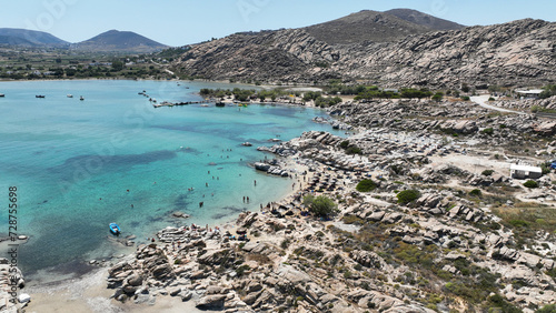 Aerial drone photo of famous small organised beach with unique rock formations of Kolimbithres or Kolympithres in the gulf of Naousa, Paros island, Cyclades, Greece