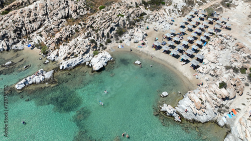 Aerial drone photo of famous small organised beach with unique rock formations of Kolimbithres or Kolympithres in the gulf of Naousa, Paros island, Cyclades, Greece photo