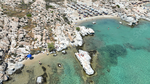 Aerial drone photo of famous small organised beach with unique rock formations of Kolimbithres or Kolympithres in the gulf of Naousa, Paros island, Cyclades, Greece