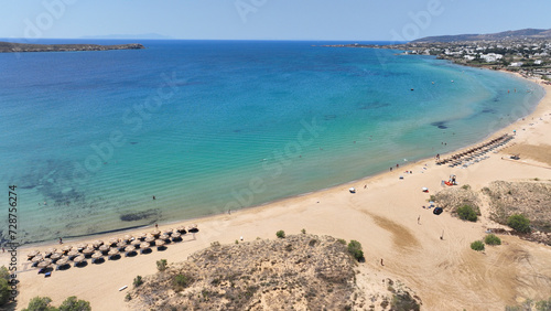 Aerial drone photo of famous for surfers sandy beach of Chrysi Akti or Golden beach with crystal clear emerald sea calm with no wind, Paros island, Cyclades, Greece