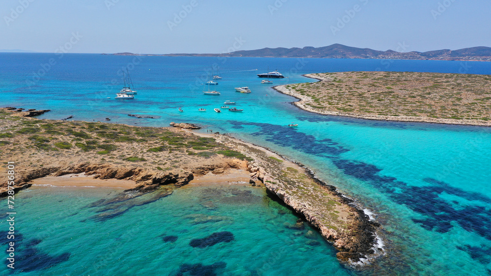 Aerial drone photo of azure paradise blue lagoon of Panteronisi a small islet complex between Paros and Antiparos islands visited by yachts and sail boats, Cyclades, Greece