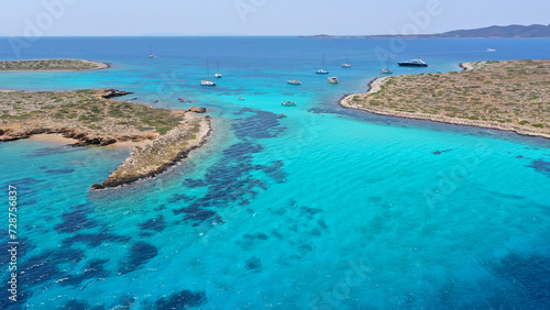 Aerial drone photo of azure paradise blue lagoon of Panteronisi a small islet complex between Paros and Antiparos islands visited by yachts and sail boats  Cyclades  Greece