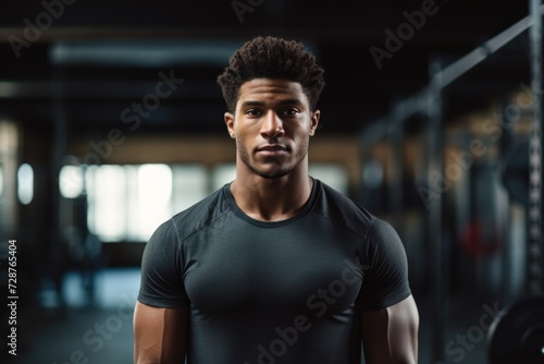 Confident young black male athlete standing in a gym © Geber86
