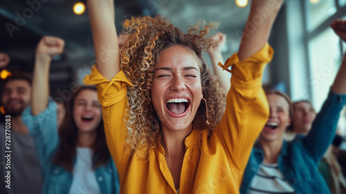 Colleagues cheering on a colleague who just received a promotion, filled with...