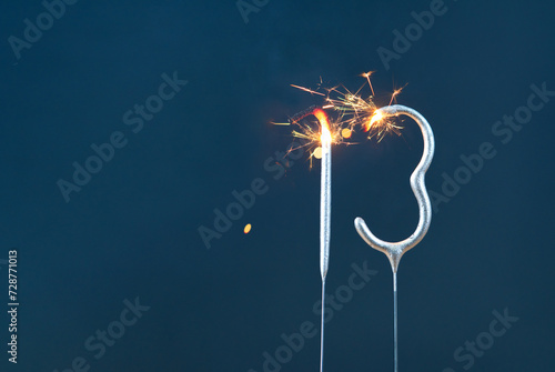 13 years celebration festive background made with Bengal fires in the form of number Thirteen. photo