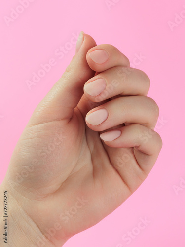 Step-by-step instructions for nail extension on gel tips. Manicure, hands in the foreground. Pink background. Copy space