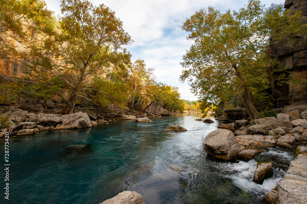 Transparent waters of Kopru River (Köprüçay, ancient Eurymedon) with its emerald green colour in Koprulu Canyon (Köprülü Kanyon) National Park, Antalya, Turkey. It's a rafting paradise Transparent waters of Kopru River (Köprüçay, ancient Eurymedon) with its emerald green colour in Koprulu Canyon (Köprülü Kanyon) National Park, Antalya, Turkey. It's a rafting paradise