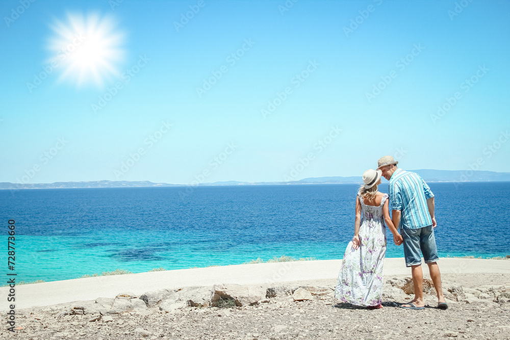A happy couple near the seashore in nature weekend travel