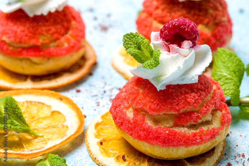 Shu cake. Custard dessert with creamy white cream, decorated with raspberries Shu cake. Custard dessert with creamy white cream, decorated with raspberries
