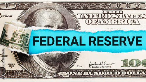 Federal Reserve. The word Federal Reserve in the background of the US dollar. Building Exterior with American Flag. Iconic Symbol of Monetary Policy and Central Banking System in the USA.