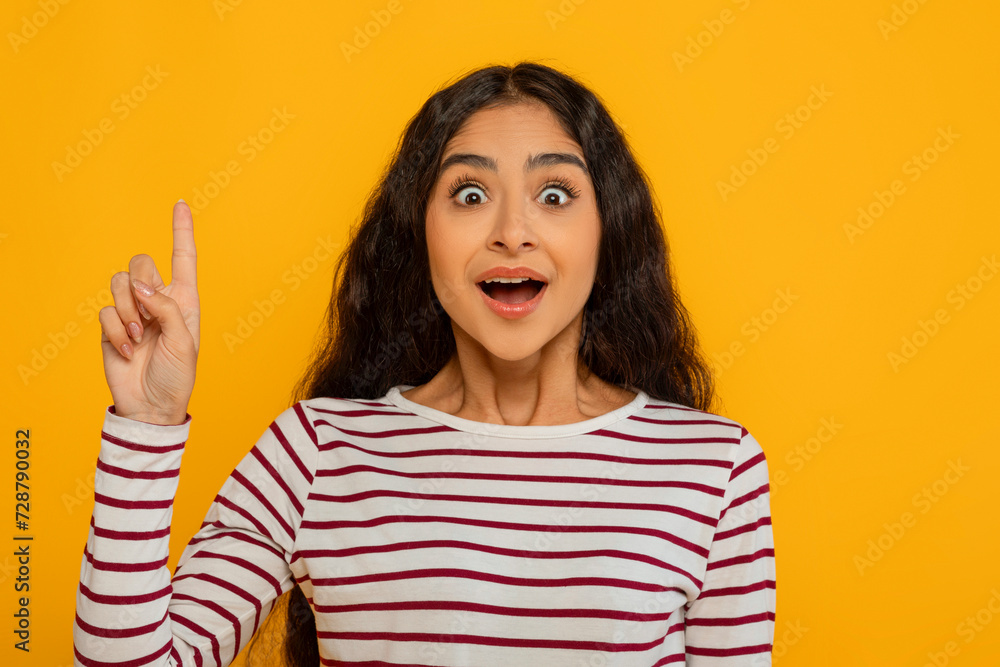 Inspired young indian woman showing eureka gesture Inspired young indian woman showing eureka gesture