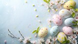 Delicate Speckled Easter Eggs with Cherry Blossoms on Soft Blue Background