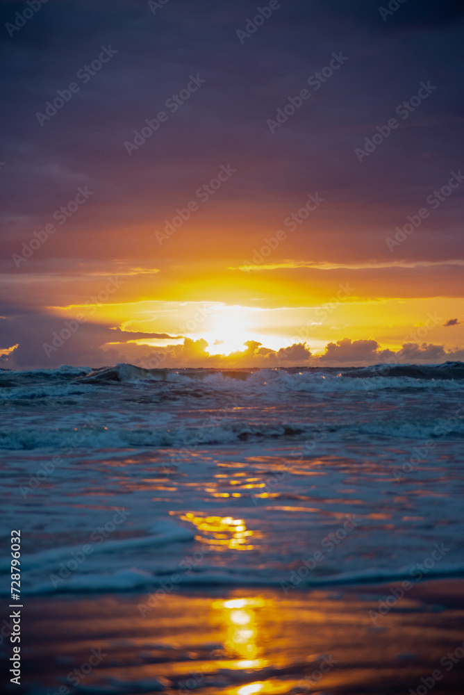 The sun setting into the sea