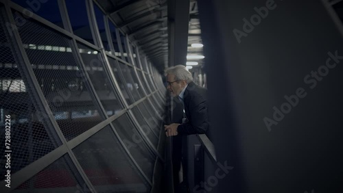 Thoughtful Elderly Gentleman with Grey Hair Thinking About Life photo
