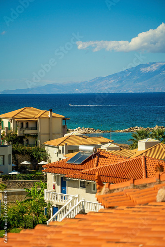 Residential building against blue mediterranean sea and mountains in a place called Drosia located in Zakynthos island, Greece © Arpan
