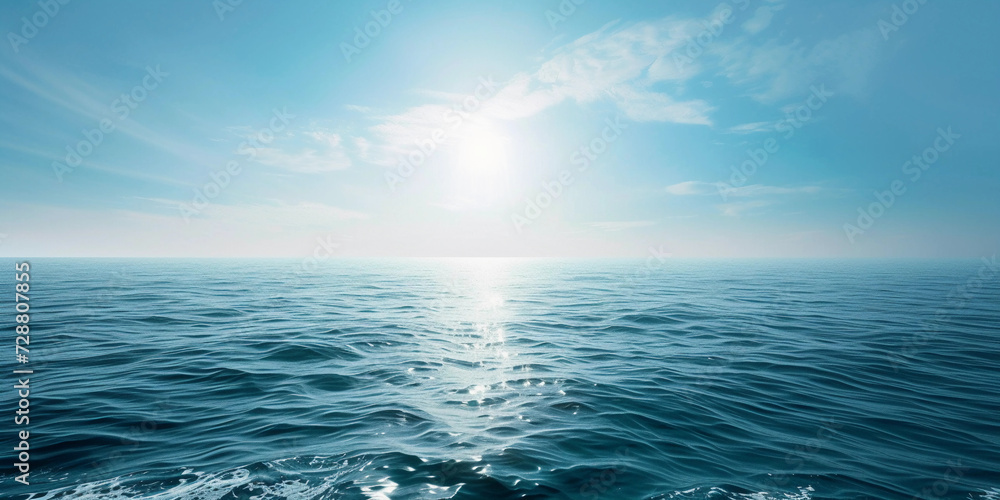 Fototapeta premium boundless ocean under a clear blue sky, symbolizing freedom, with sunlight reflecting on the water's surface, creating a serene and tranquil scene