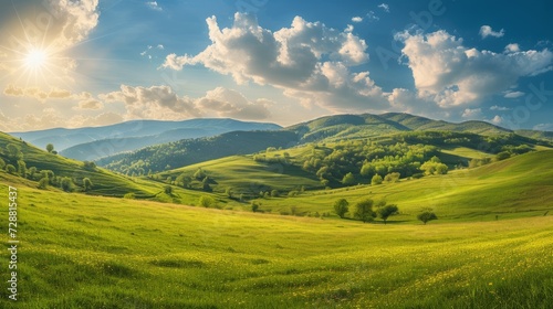 panorama of beautiful countryside of romania. sunny afternoon. wonderful springtime landscape in mountains. grassy field and rolling hills. rural scenery © Emil