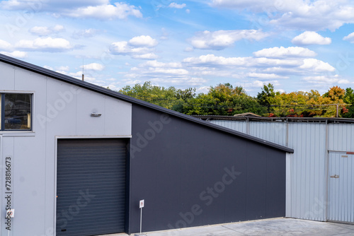 Modern house with garage and roof made of metal sheets.