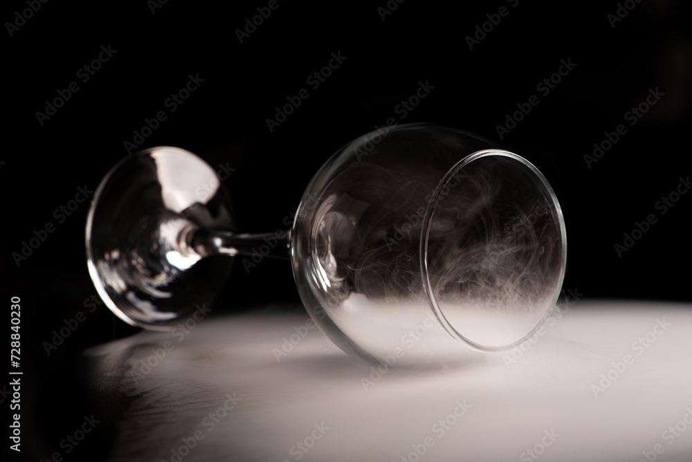 Crystal glass, beautiful Crystal glass with smoke on black background, selective focus.