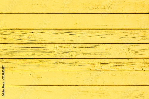 Wooden plank background. Yellow color wood. Vibrant sunny color board. Wood structure. Vintage pattern design. Parallel lines retro template. Peeling paint wood. Horizontal plank backdrop.