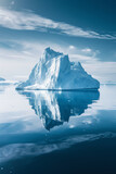 A big piece of iceberg floating in the ocean, reflected in calm sea water. Beautiful glacial landscape