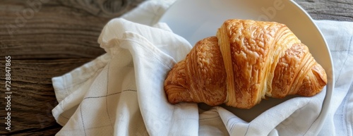 Croissant on Plate on Table