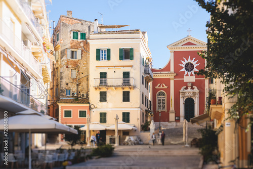 Fototapeta Naklejka Na Ścianę i Meble -  Corfu street view, Kerkyra old town beautiful cityscape, Ionian sea Islands, Greece, a summer sunny day, pedestrian streets with shops and cafes, architecture of historic center, travel to Greece