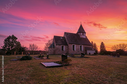 Church at sunset with burning sky