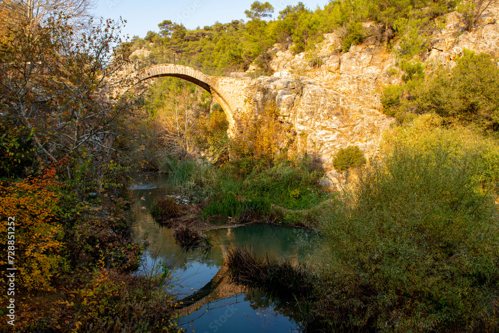 Turkey's waterfalls and rivers. Historic stone bridge and waterfall. Clandras bridge and Clandras waterfall. Usak , Turkey Turkey's waterfalls and rivers. Historic stone bridge and waterfall. Clandras bridge and Clandras waterfall. Usak , Turkey