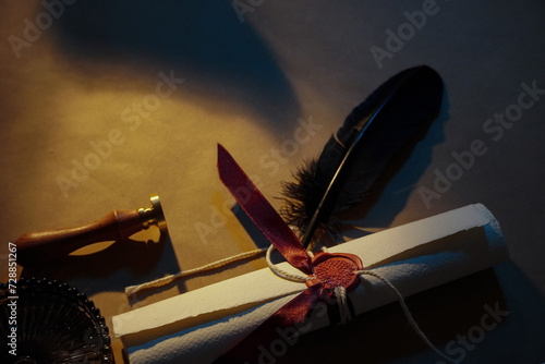 Tableau sur toile Medieval scroll letter tied with red ribbons and sealed with wax stamp next to t