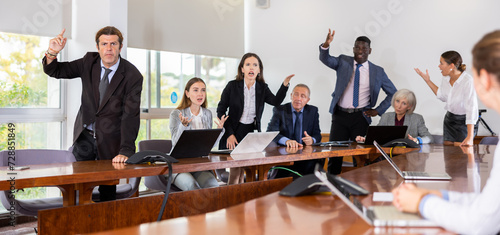 Bild auf Leinwand Agitated multiethnic business coworkers arguing at corporate team briefing tryin