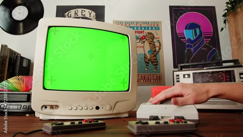 Vintage tv chroma key green screen with Old TV Game Console with ROM Cartridge with TV, Vintage Gamer Room Joystick and Retro TV, Man Player Start the Game, Play.
