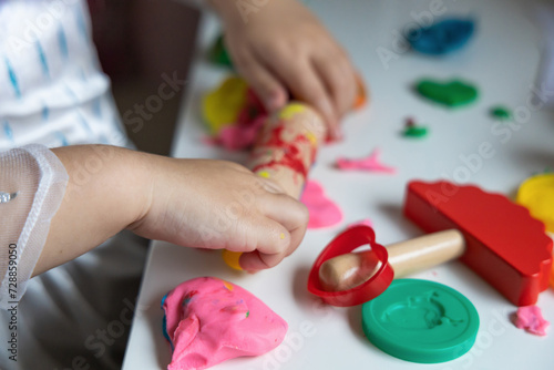 Child development and children's creativity. The child is engaged in modeling plasticine.
