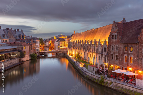 Medieval houses on quay of Leie river at night, Old Town of Ghent, Belgium © Kavalenkava
