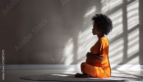 A serene pregnant woman in an orange robe sits gracefully on the floor, surrounded by a peaceful indoor atmosphere as she receives guidance from a monk