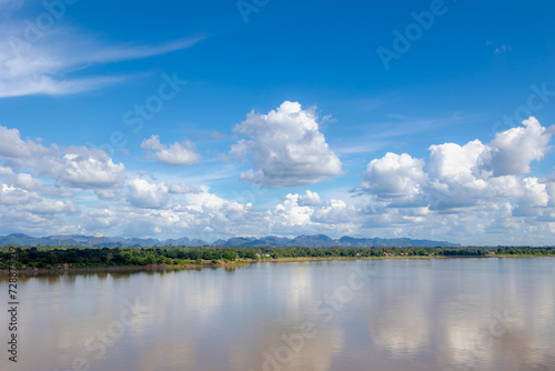 Landscape view of Laos along Mekong river, Big mountain, small villages and forest, Riverside between Thai and Laos border with blue sky, Nakhon Phanom province, Northeastern Thailand also called Isan