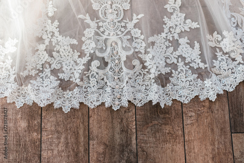 white lace on wooden background photo