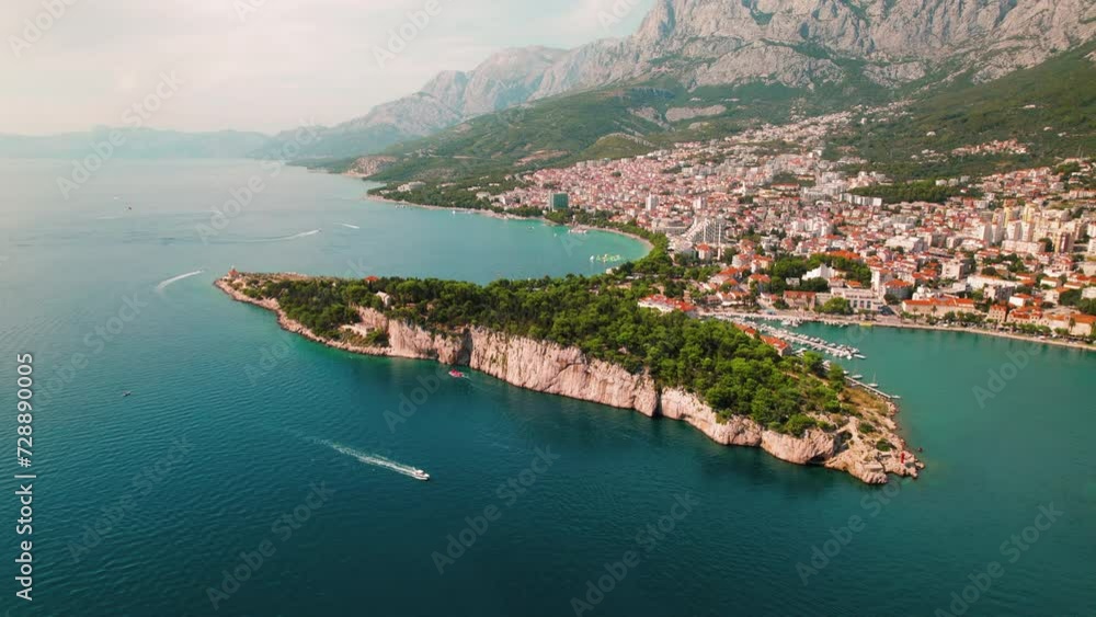 Makarska Riviera's Picturesque Coastline with Serene Sea and Verdant Peaks. Aerial view of peaceful town and nature along Croatian coast. Makarska Riviera's Picturesque Coastline with Serene Sea and Verdant Peaks. Aerial view of peaceful town and nature along Croatian coast.
