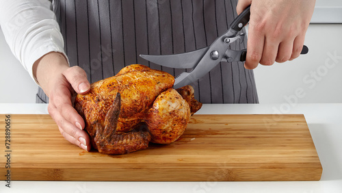 Closeup of man using poultry shears. photo