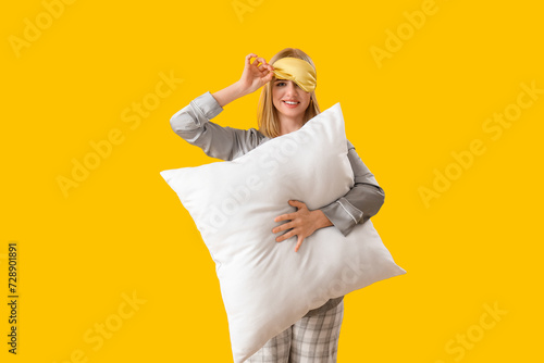 Happy young woman in pajama...