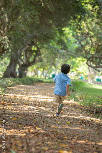 Little kids sibling friends running joyful in a park childhood freedom