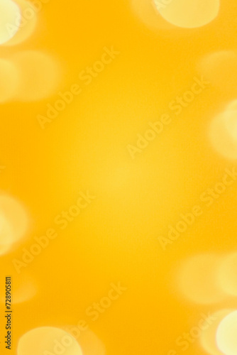 Bright yellow soft textured background with bokeh