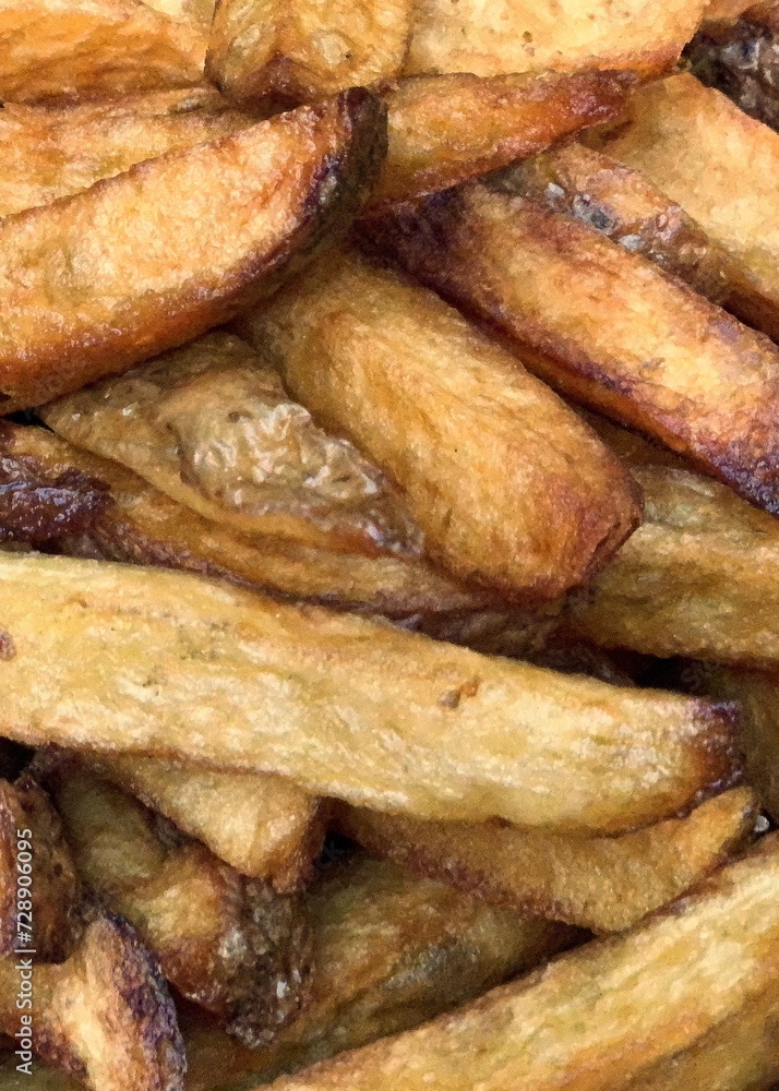 French fries with the potato skin on frying dark French fries with the potato skin on frying dark