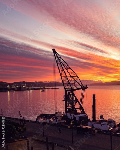 Crane by the harbour at sunrise
