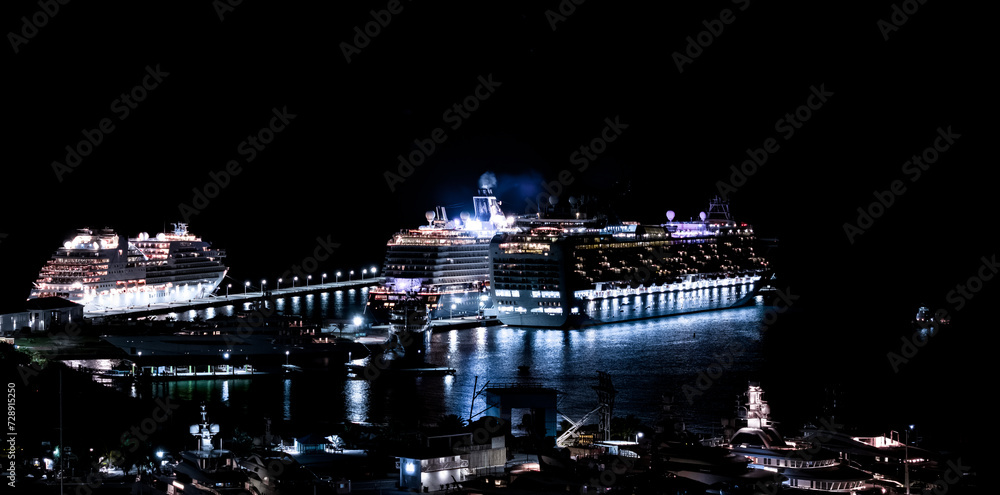 Beautiful scenic aerial night view cruise ships docked on the Caribbean island of St Maarten. 