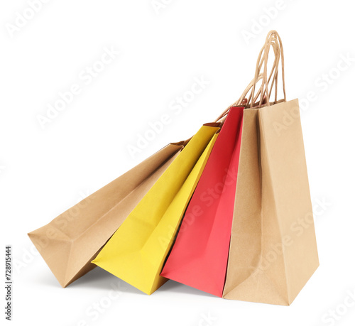 Colorful and kraft paper shopping bags isolated on white