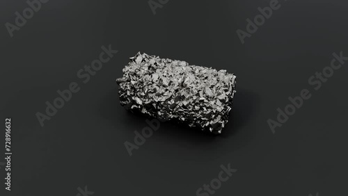 Rough, metallic textured titanium mineral on a dark surface.