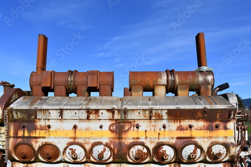 Diesel locomotive engine against clear blue sky. photo