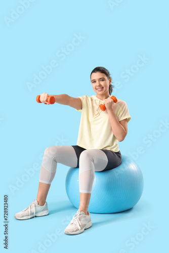 Young woman training with d...